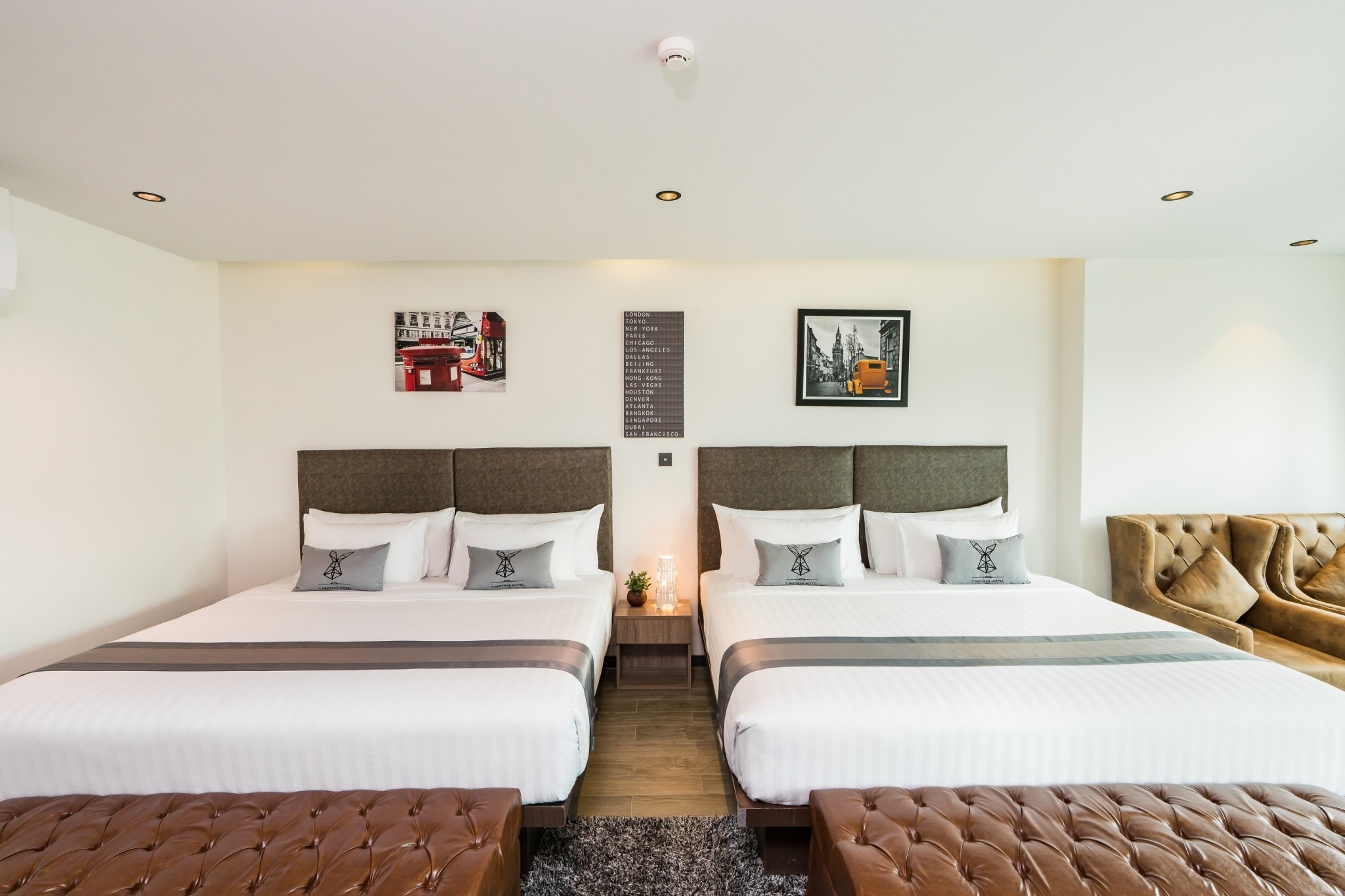 Family Suite — multiple beds for up to 4 guests at T Pattaya Hotel
